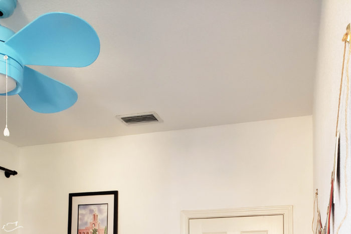 Blue ceiling fan in office remodel