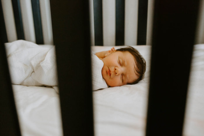 Sleeping baby in a crib.