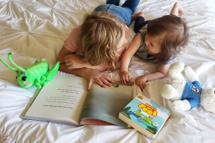 Sisters reading together.
