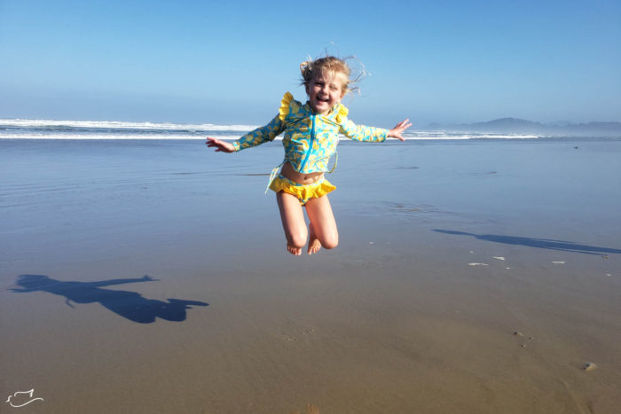 Jumping for joy on the coast in SwimZip.