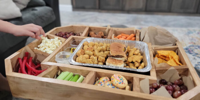 A snackadium piled high with snacks and treats for watching football.